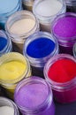 Lot of multicolored paint in jars for makeup artistry Royalty Free Stock Photo