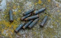 a lot of old rusty shot cartridges found on the land Royalty Free Stock Photo