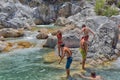 A lot of people bathing in a mountain stream canyon Kuzdere during jeep safari on the Taurus mountains. Royalty Free Stock Photo