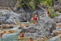 A lot of people bathing in a mountain stream canyon Kuzdere during jeep safari on the Taurus mountains. Royalty Free Stock Photo