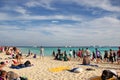 A lot of people on the beach of the island
