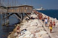 A lot of people on the beaches of Chioggia Sottomarina here we are on the dam of the marina where people take a long walk.