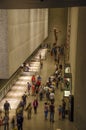 Lot of people, citizens and tourists, visit the interior of the 9/11 National Memorial Museum in New York City - United States of