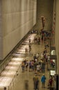 Lot of people, citizens and tourists, visit the interior of the 9/11 National Memorial Museum in New York City - United States of