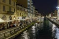 Lot of people on embankment at Naviglio Grande , Milan, Italy