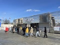 Moscow, Russia, February, 20, 2024. A lot of people in front of the entrance to the Guest center \