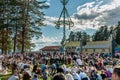 Lot of people ring dancing around the midsummer pole