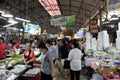 A lot of people shopping in the Mae Klong fresh food market.