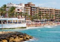 Lot of people sunbathing in Playa del Cura beach, Torrevieja, Spain