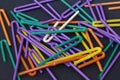 A lot of plastic tubules for drinks. Close-up of straw multi-colored tubes