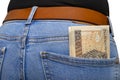 A lot of Polish banknotes with a nominal value of 200 PLN inserted into the back pocket of women blue denim pants, isolated on a w Royalty Free Stock Photo