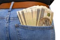 A lot of Polish banknotes with a nominal value of 200 PLN inserted into the back pocket of women blue denim pants, isolated on a w Royalty Free Stock Photo