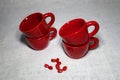 Lot of red colored ceramic coffee cups