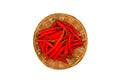 A lot of red hot chilli pepper in weave basket on white background Royalty Free Stock Photo