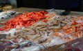 A lot of red prawns, white prawns and langoustines in a food market Royalty Free Stock Photo