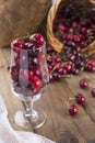 A lot of ripe and sweet cherries, on the table and in a glass, for traditional Belgian beer. Delicious red berries. Copy space
