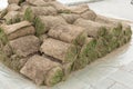 A lot of rolled grass lies in a heap, prepared for landscaping Royalty Free Stock Photo