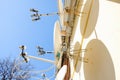 A lot of satellite dishes mounted on the wall. Royalty Free Stock Photo