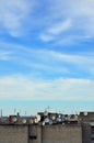 A lot of satellite television antennas on the rooftop under a bl Royalty Free Stock Photo