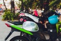 A lot of scooters in the parking, background. Mopeds are on the street. bike for rent. Royalty Free Stock Photo