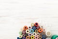 Background of colorful sewing threads on white table Royalty Free Stock Photo