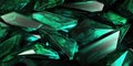 A lot of sharp emerald crystals with reflections and bright highlights