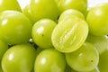 A lot of Shine-Muscat grapes and cut Shine-Muscat grapes on a white background