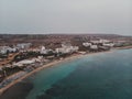 A lot of ships are in the port near the shore on the background of a beautiful sunset. Mediterranean coast of Cyprus Royalty Free Stock Photo