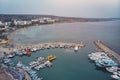A lot of ships are in the port near the shore. Small boats parked at the pier in the evening light. Mediterranean coast of Cyprus Royalty Free Stock Photo