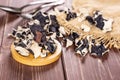 Dry black mushroom ear on brown wood Royalty Free Stock Photo