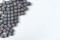 A lot of small cubes with letters on a white background. Royalty Free Stock Photo