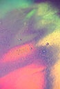 A lot of small drops of water on a colorful pastel holographic background. Abstract background with copy space Royalty Free Stock Photo