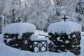 Snow-covered Cemetery Gate with Heart-shaped Snow Formation on the Cross