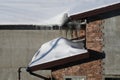 A lot of snow on the roofe. Winter icicles hanging from eaves of roof. Royalty Free Stock Photo