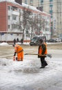 Snow cleaning by workers of city services in the city of Belgorod of Russia.