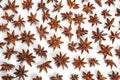 A lot of star anise on a white background close-up Royalty Free Stock Photo