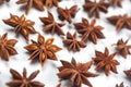 A lot of star anise on a white background close-up Royalty Free Stock Photo