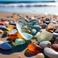 A lot of stones of different shapes and in the shape of a big heart on the ocean or sea on a sandy beach. Glowing Royalty Free Stock Photo