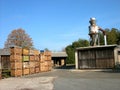 Lot of storage boxes with firewood in a factory at daytime