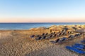 A lot of sunbed, straw umbrella on beautiful rasing sun beach ba Royalty Free Stock Photo