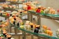 A lot of sushi rolls on the glass buffet. Japan traditional food on table with eastern decor. catering Royalty Free Stock Photo