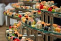 A lot of sushi rolls on the glass buffet. Japan traditional food on table with eastern decor. catering Royalty Free Stock Photo