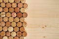 A lot of wine corks on the wooden background close up, top view. Royalty Free Stock Photo