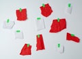 Lot of torn red and white pieces of paper glued with green scotch tape Royalty Free Stock Photo