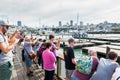 A lot of tourist watching the sea Lions or Seals relaxing, sunbathing and barking on a pier of  the Fisherman`s Wharf Pier 39  of Royalty Free Stock Photo