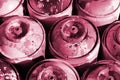 A lot of used metal tanks with paint for drawing graffiti Image toned in Viva Magenta, color of the 2023 year