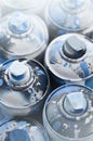 A lot of used spray cans of paint close-up. Dirty and smeared cans for drawing graffiti. The concept of a sweeping and careless d Royalty Free Stock Photo