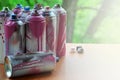 A lot of used spray cans of paint close-up. Dirty and smeared cans for drawing graffiti. The concept of a sweeping and careless d Royalty Free Stock Photo