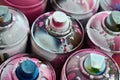 A lot of used spray cans of paint close-up. Dirty and smeared cans for drawing graffiti. The concept of a sweeping and careless d Royalty Free Stock Photo