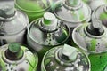 A lot of used spray cans of paint close-up. Dirty and smeared cans for drawing graffiti. The concept of a sweeping and careless d Royalty Free Stock Photo